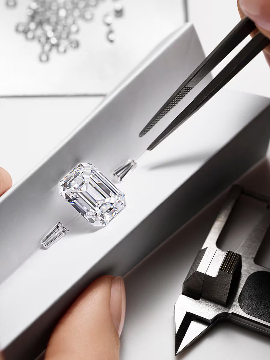 Diamond being held with tweezers by Stephea Certified Gemologist